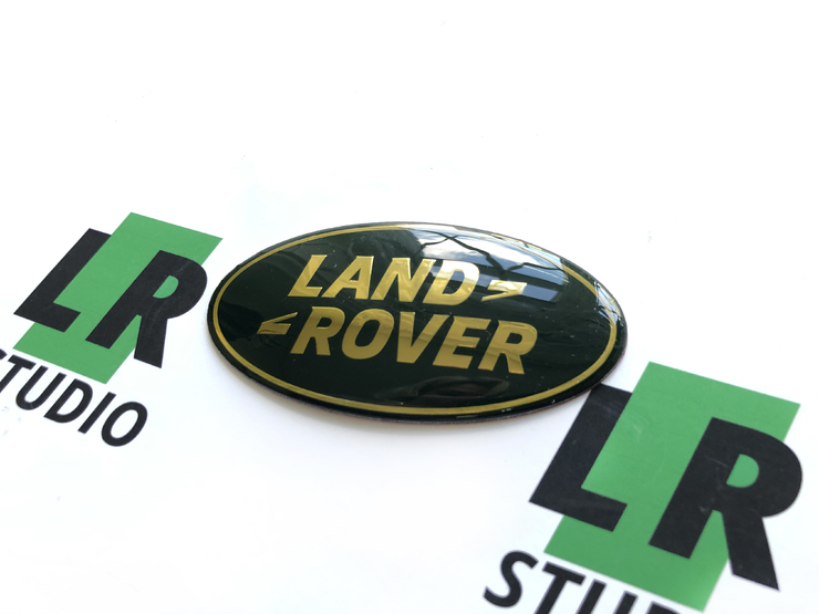 Эмблема Land Rover зеленая с золотом 86мм