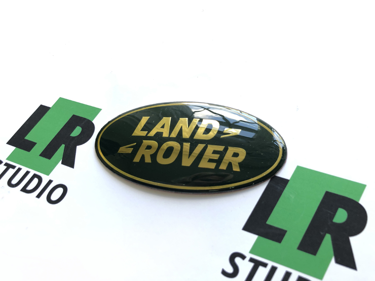 Эмблема Land Rover зеленая с золотом 86мм
